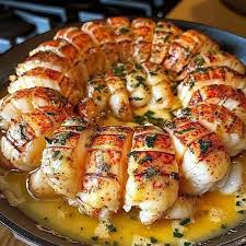GRILLED LOBSTER (350g).  ( well seasoned lobster grilled with A touch of butter and olive oil Served with garlic sauce, sweet Corn,Pita bread and rosemary Potatoes