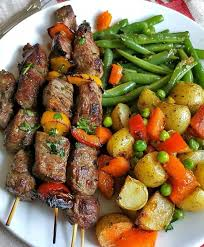 BEEF SKEWERS (2).  (Well marinated beef, cut in cubes) And skewed with veggies
