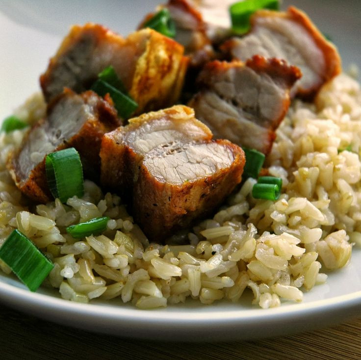PORK FRIED RICE / JOLLOF.  ( pork belly cut into cubes, ) mixed VEGGIES , rice grains Served with green chili