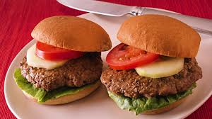 BEEF BURGER  ( minced beef , slice tomato) Sliced onions, slice cucumber Lettuce, Burger cheese, served with Sauce of choice and fries